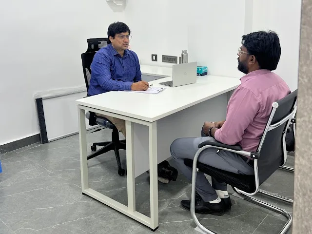 A consultation room at CION L.B. Nagar, with a doctor and a visitor at the desk