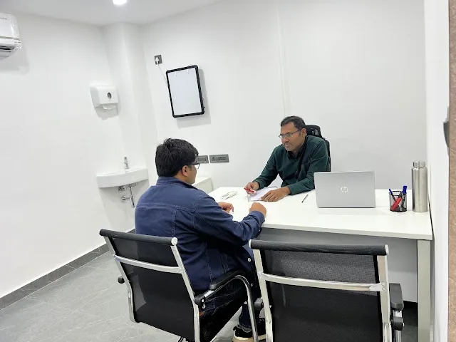 A doctor and a visitor in a consultation room at CION L.B. Nagar