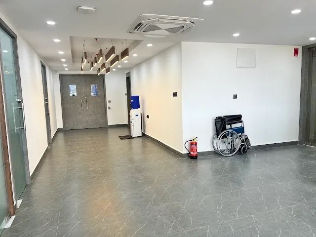 Corridor and waiting area at CION L.B. Nagar, with a wheelchair and a water dispenser