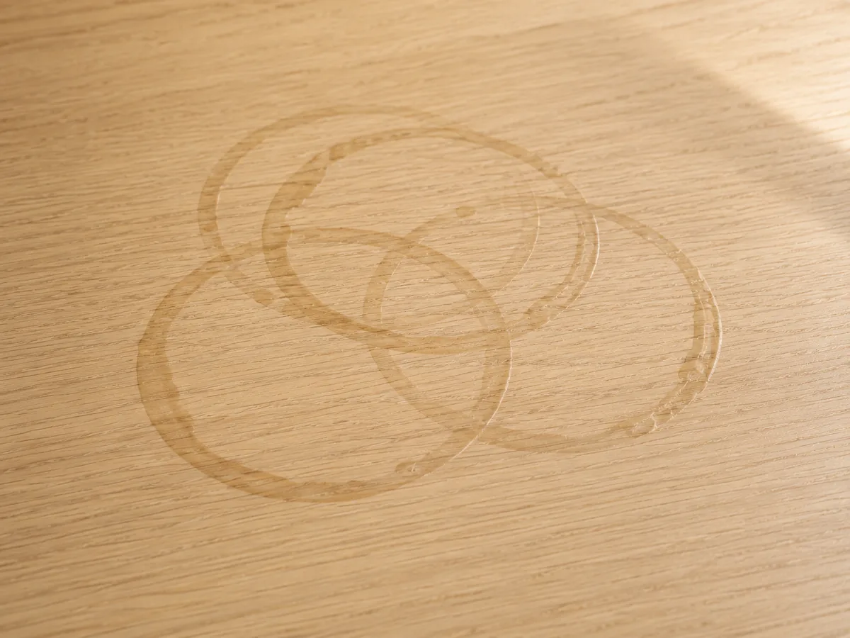 Overlapping cup rings on a table, marking the same spot again and again
